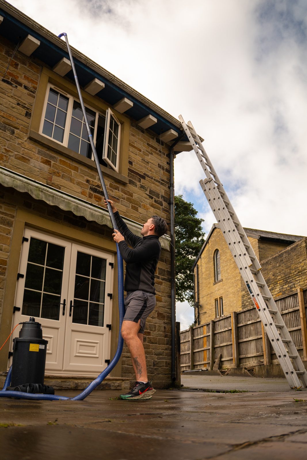 Clearing the gutters on a stone semi
