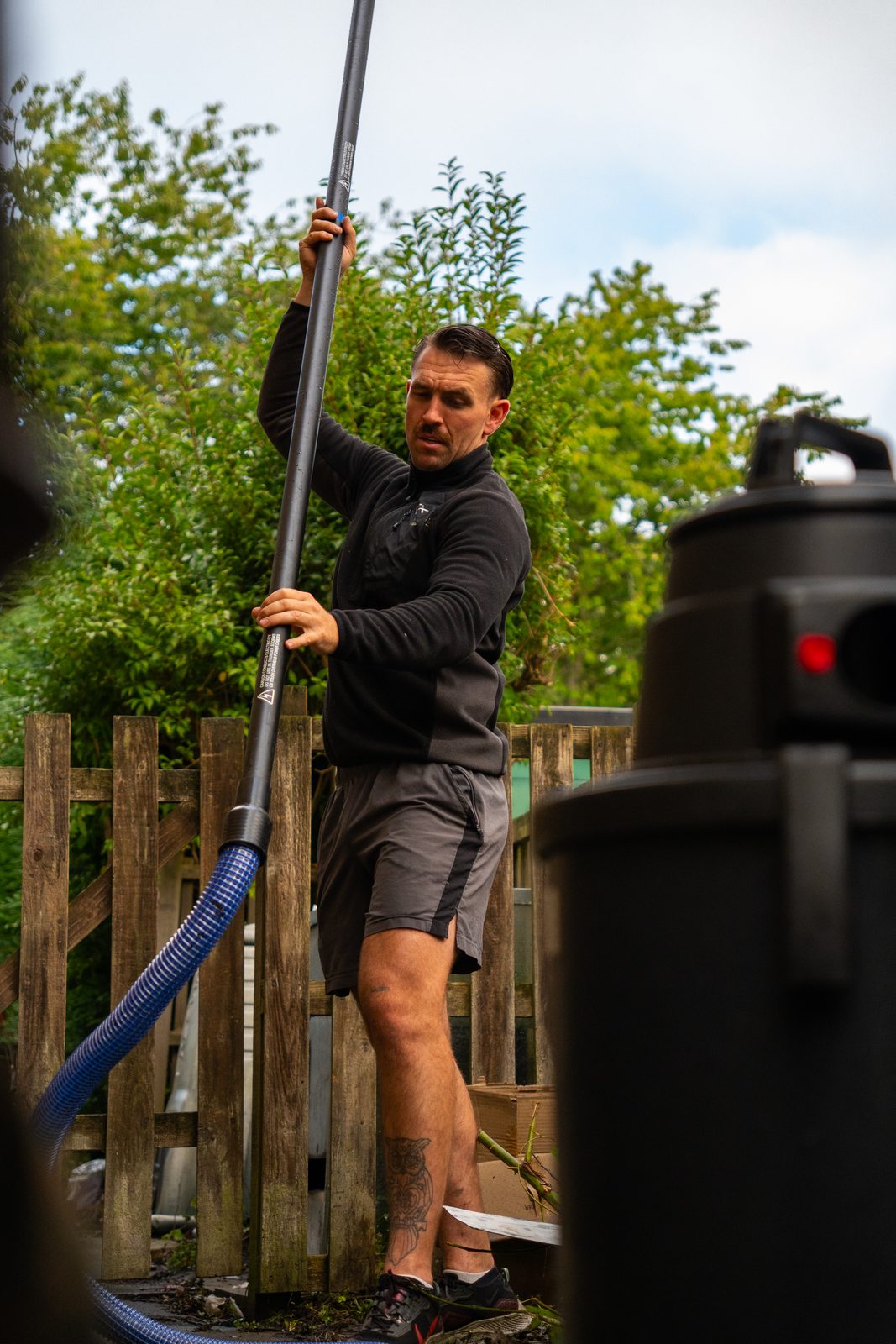 George working a pole from the ground